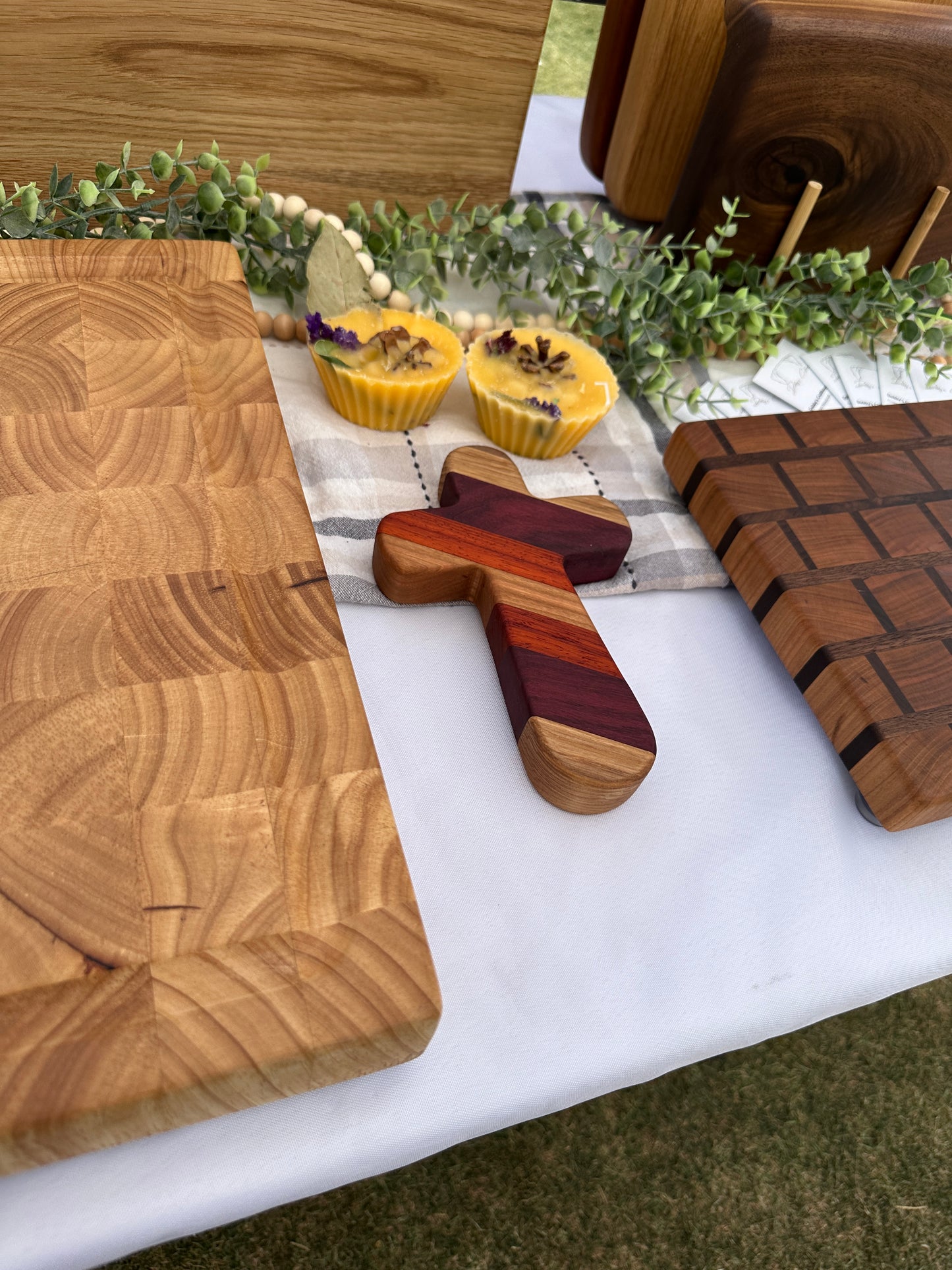 Add a timeless touch of faith and artistry to your home with this handcrafted wooden cross. Measuring 6-1/2" long by 4-1/8" wide, this cross is carefully crafted from premium strips of purple heart, paduak, white oak, hard maple, walnut, and cherry woods. Each cross is a unique piece, showcasing the natural beauty and rich tones of these high-quality hardwoods.